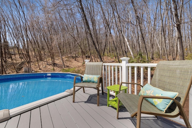 outdoor pool featuring a deck