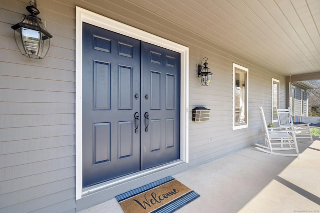 property entrance featuring covered porch