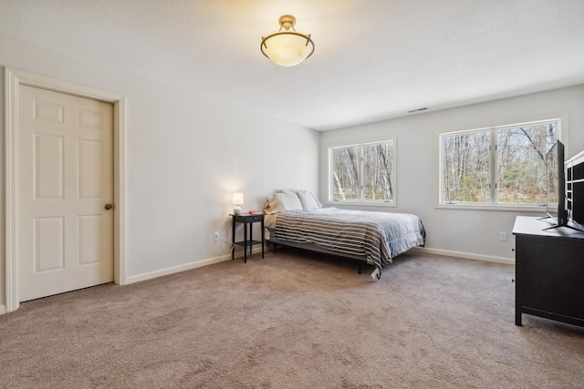 bedroom featuring carpet, visible vents, and baseboards