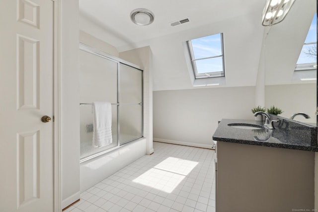 bathroom with baseboards, visible vents, a skylight, vanity, and enclosed tub / shower combo