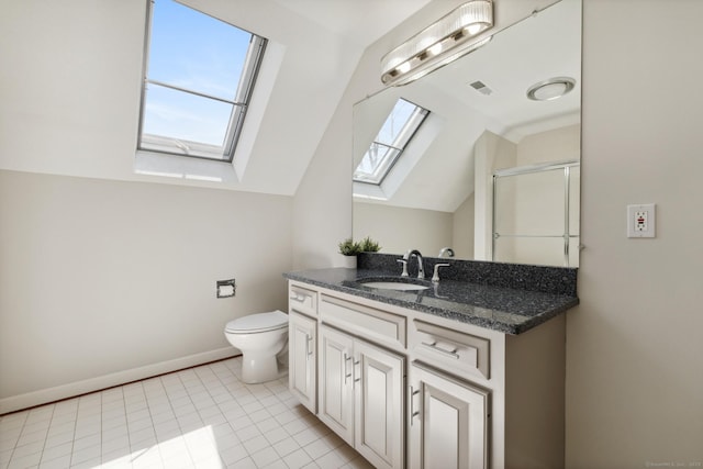 full bathroom featuring a shower with door, toilet, vanity, baseboards, and vaulted ceiling with skylight