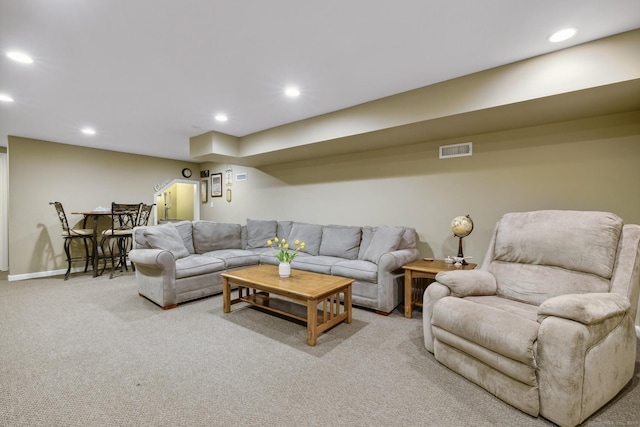 living room with light colored carpet, baseboards, visible vents, and recessed lighting