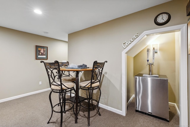 dining space featuring recessed lighting, carpet floors, and baseboards