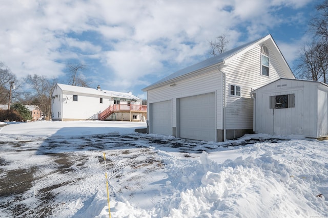 view of snow covered garage