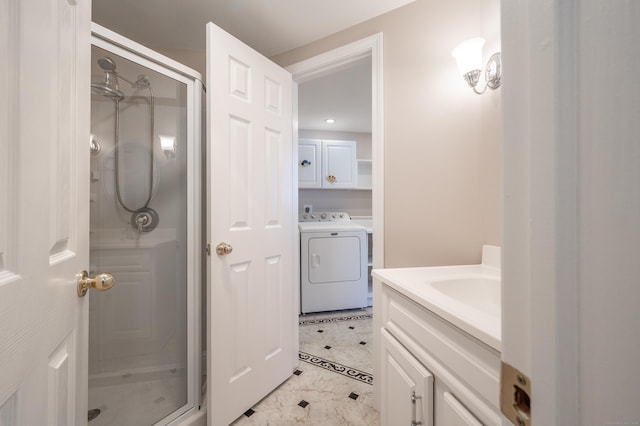 bathroom featuring a shower with shower door, tile patterned floors, and vanity