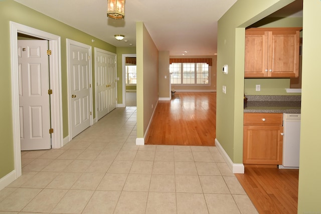 hallway featuring light tile patterned floors