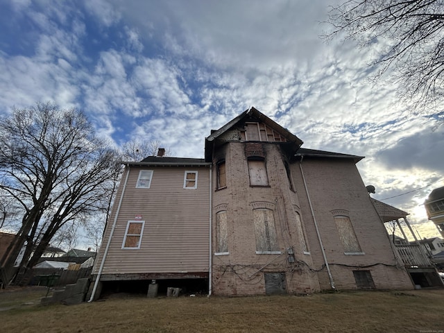 back of property with a yard