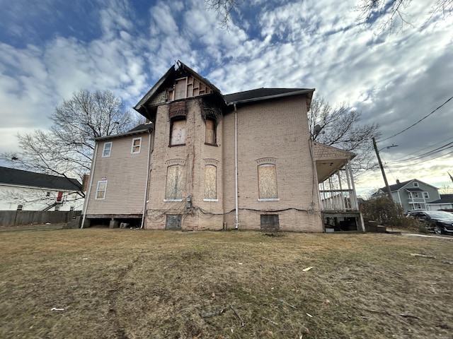 back of house with a yard