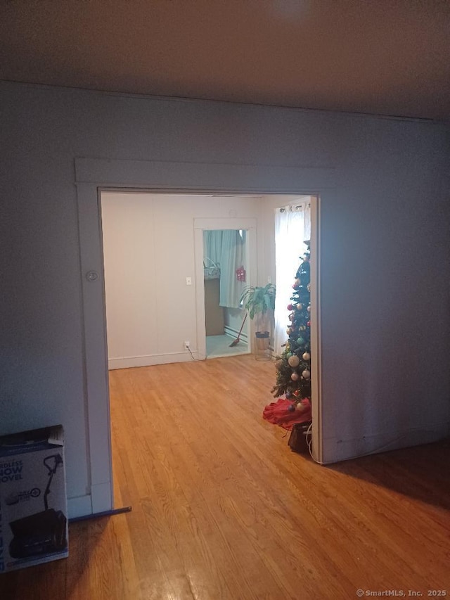 corridor featuring hardwood / wood-style floors