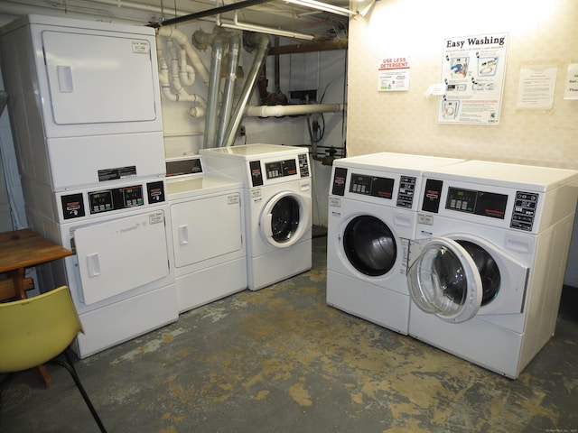 washroom with stacked washer / drying machine and washer and clothes dryer