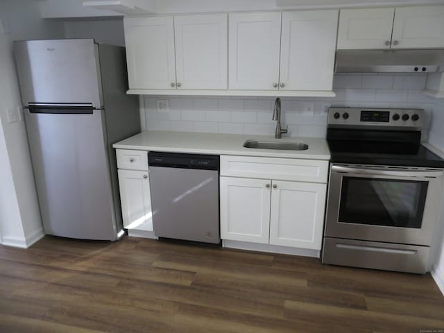 kitchen featuring sink, stainless steel appliances, dark hardwood / wood-style floors, and white cabinets