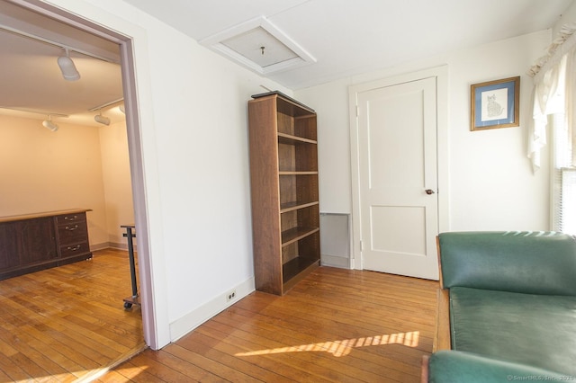 living area with hardwood / wood-style flooring