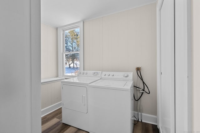 washroom featuring washer and clothes dryer and dark hardwood / wood-style flooring