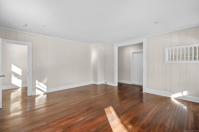 spare room with dark hardwood / wood-style flooring