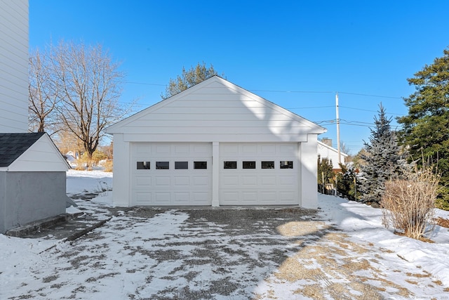 view of snow covered garage