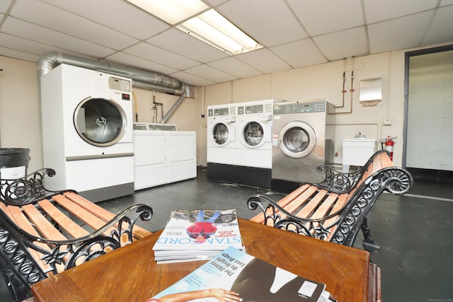 clothes washing area with independent washer and dryer