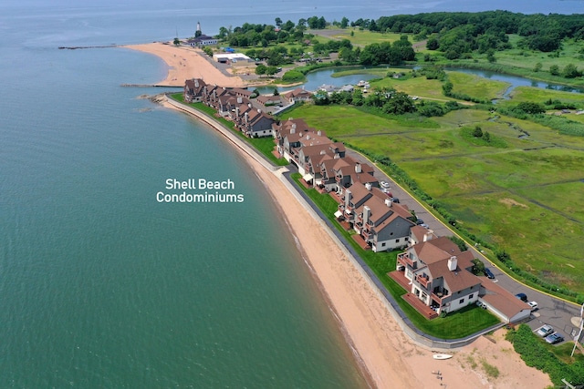 aerial view featuring a water view and a beach view