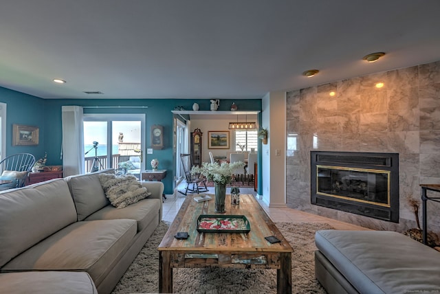 tiled living room with a fireplace and a wealth of natural light