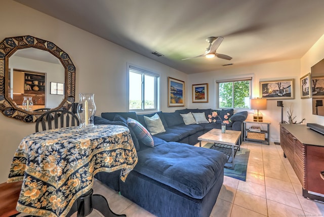 living room featuring ceiling fan and light tile patterned floors