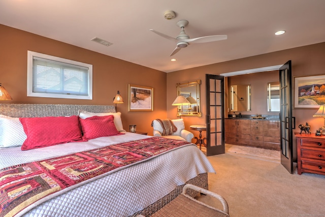 bedroom featuring ceiling fan, french doors, and light colored carpet