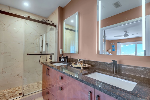 bathroom with ceiling fan, walk in shower, and vanity