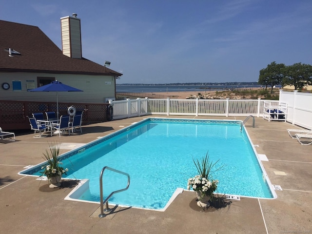 view of swimming pool featuring a patio area