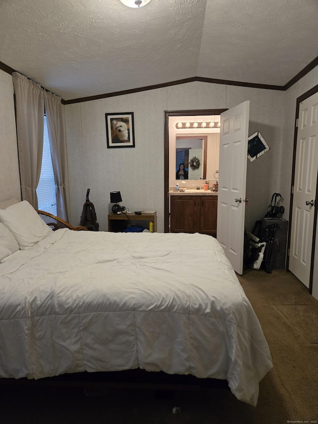 carpeted bedroom featuring lofted ceiling, crown molding, and a textured ceiling