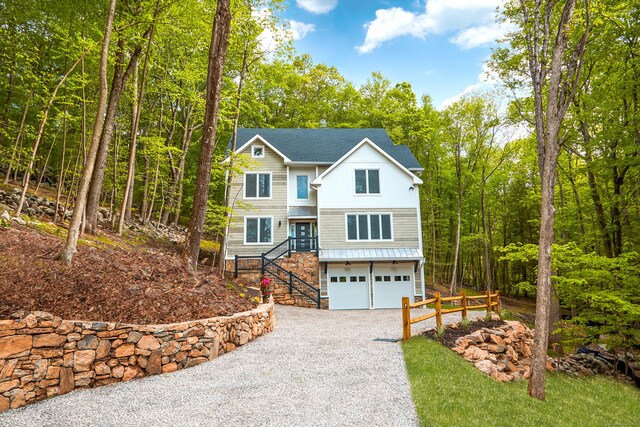 1240 Westport Tpke, Fairfield, CT 06824 - view of front of home featuring a garage and gravel driveway