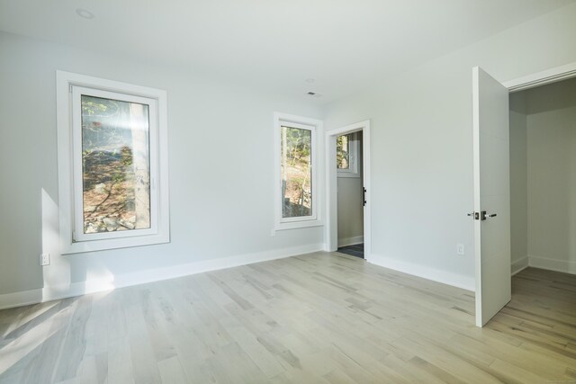 1240 Westport Tpke, Fairfield, CT 06824 - spare room featuring baseboards and light wood-style floors
