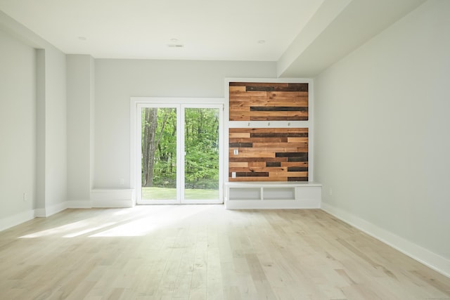 unfurnished living room with light hardwood / wood-style floors