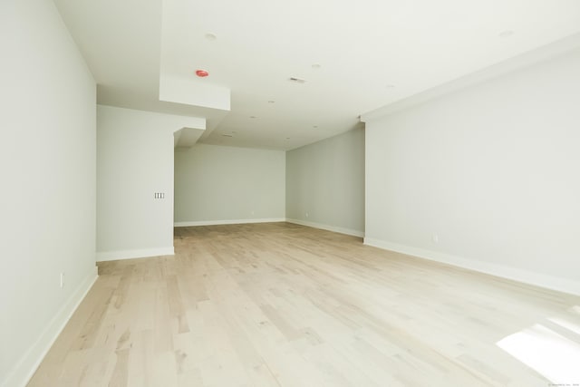 spare room with light wood-type flooring