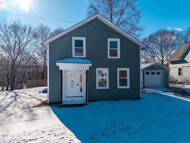 front facade featuring an outbuilding and a garage