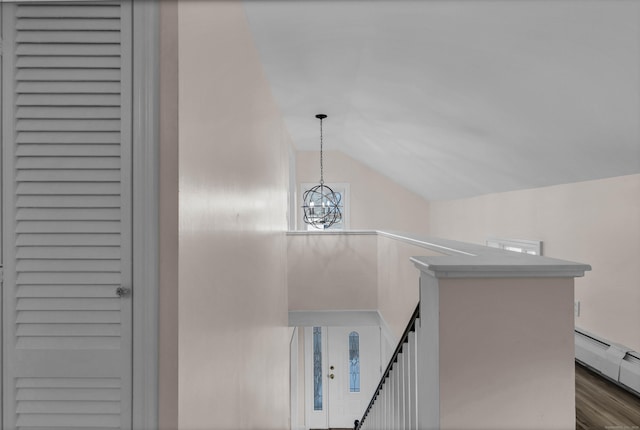 interior details featuring a notable chandelier and baseboard heating