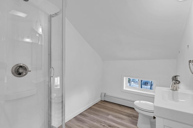 bathroom with baseboard heating, hardwood / wood-style floors, a shower with shower door, and lofted ceiling