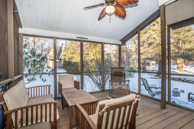 sunroom / solarium with plenty of natural light and ceiling fan