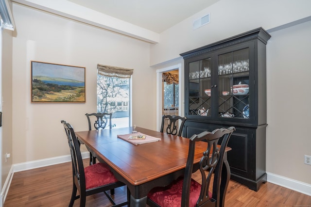 dining room with hardwood / wood-style flooring