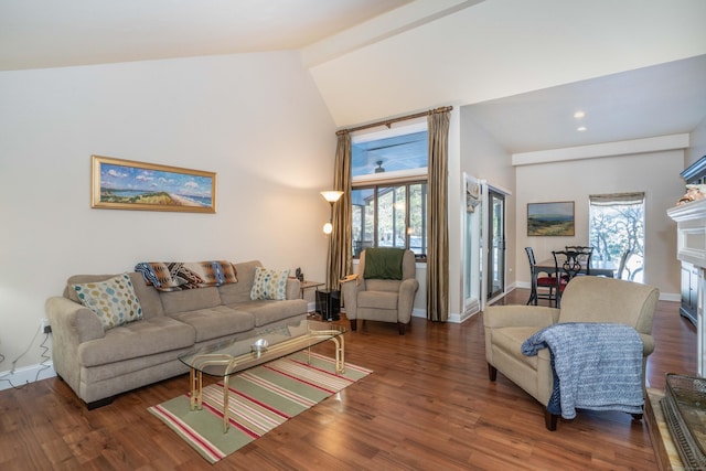 living room with plenty of natural light, dark hardwood / wood-style flooring, high vaulted ceiling, and beam ceiling