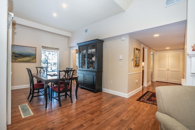 dining room with dark hardwood / wood-style flooring