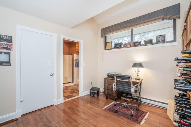 home office with hardwood / wood-style flooring and a healthy amount of sunlight