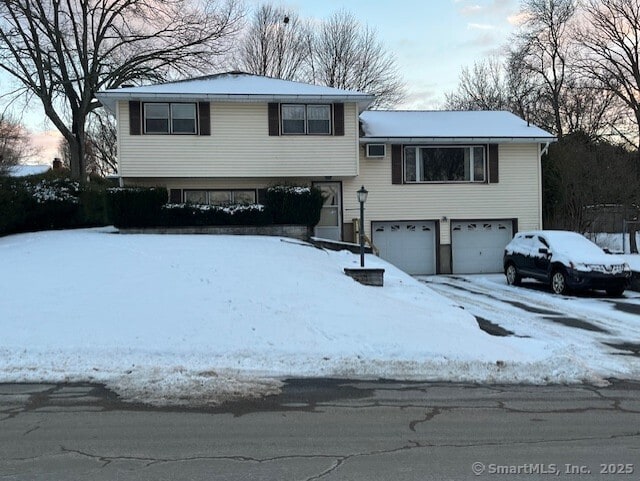 split level home featuring a garage