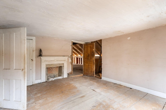 unfurnished living room with vaulted ceiling