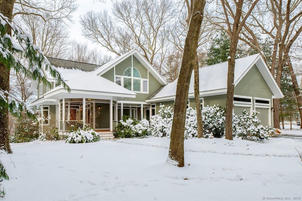 view of front of property featuring a garage and a porch