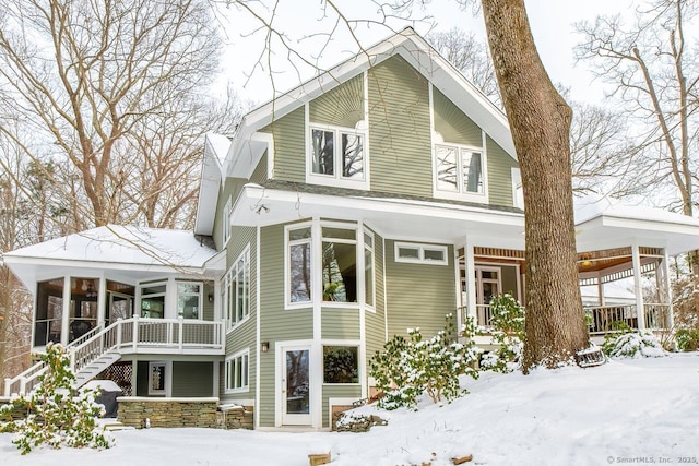 exterior space featuring a sunroom