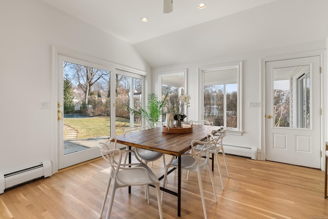 sunroom / solarium featuring ceiling fan, lofted ceiling, and baseboard heating