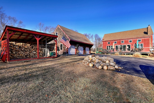 view of side of property featuring a garage