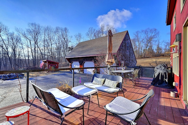 wooden terrace featuring outdoor lounge area