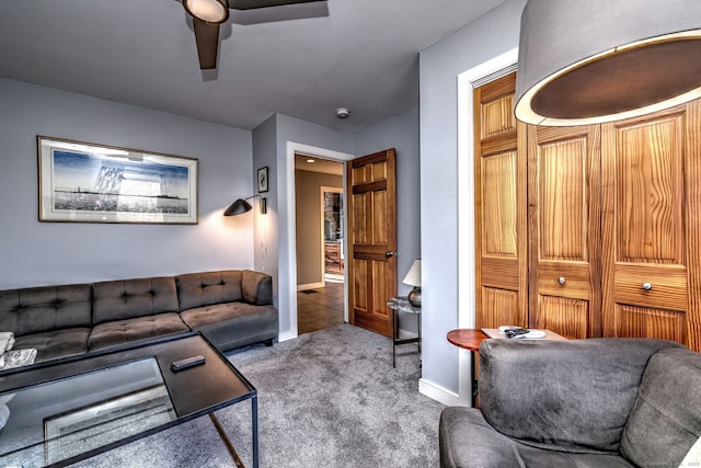 living room featuring carpet floors and ceiling fan