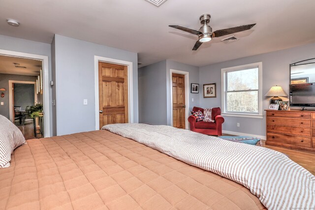 bedroom featuring ceiling fan and light hardwood / wood-style flooring