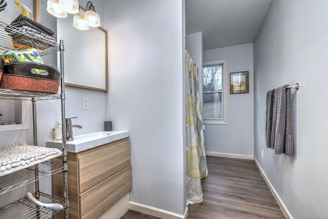 bathroom featuring hardwood / wood-style floors and vanity