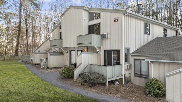 rear view of house with a yard